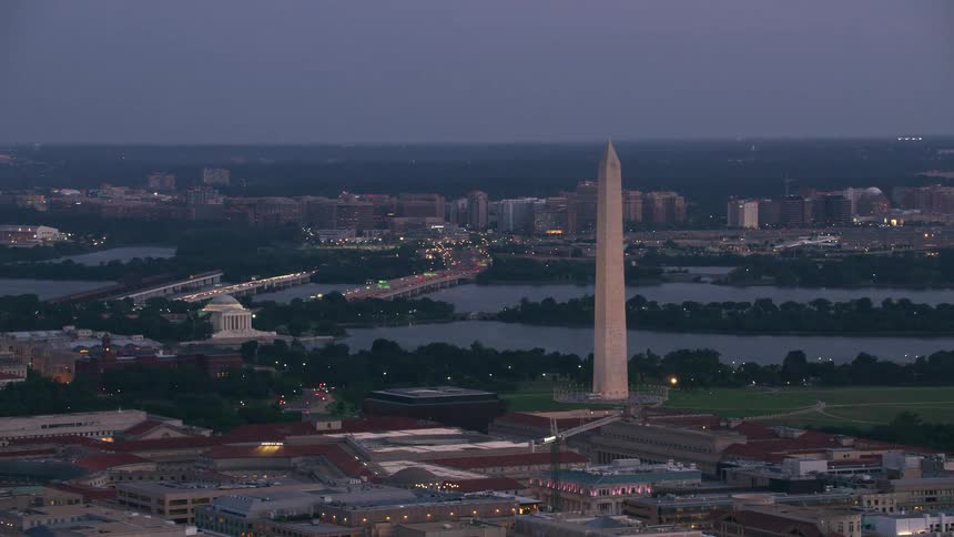 Buildings and the washington monument in the national mall in washington dc and the capitol building is in the distance