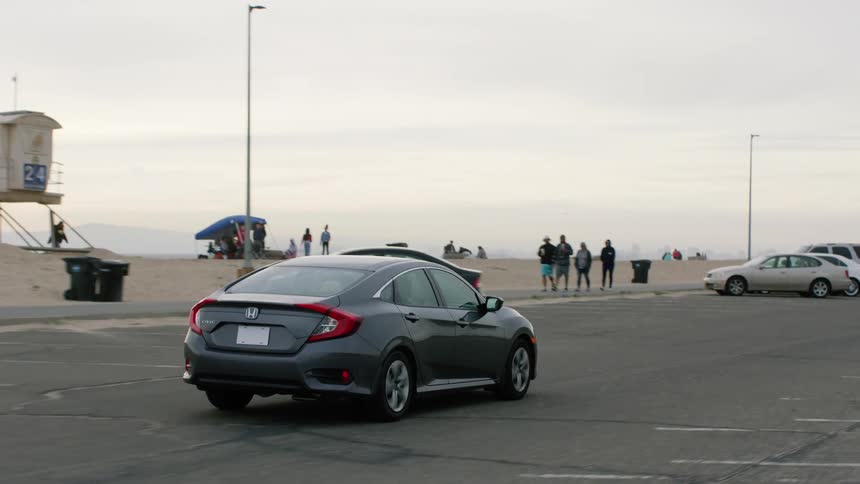 A view of a car driving outdoors