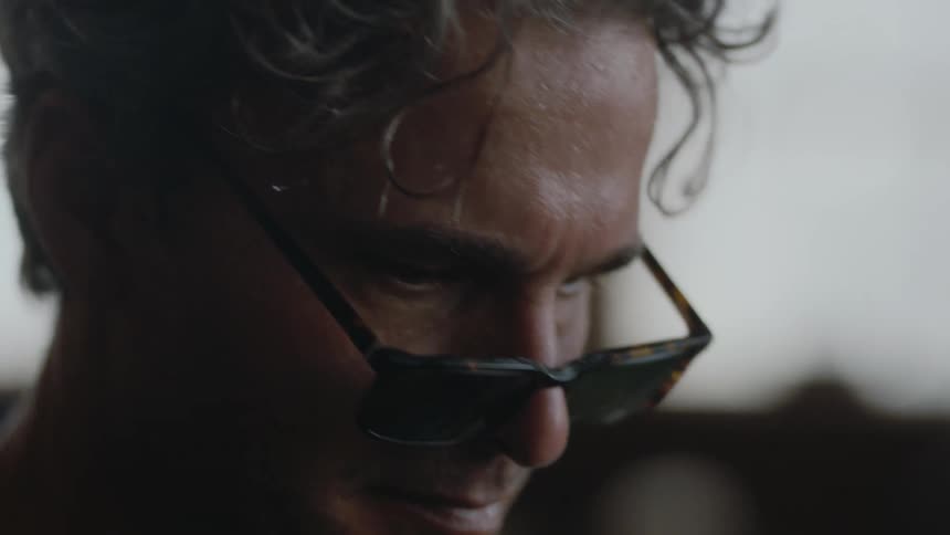 Artist with glasses concentrating and working hard