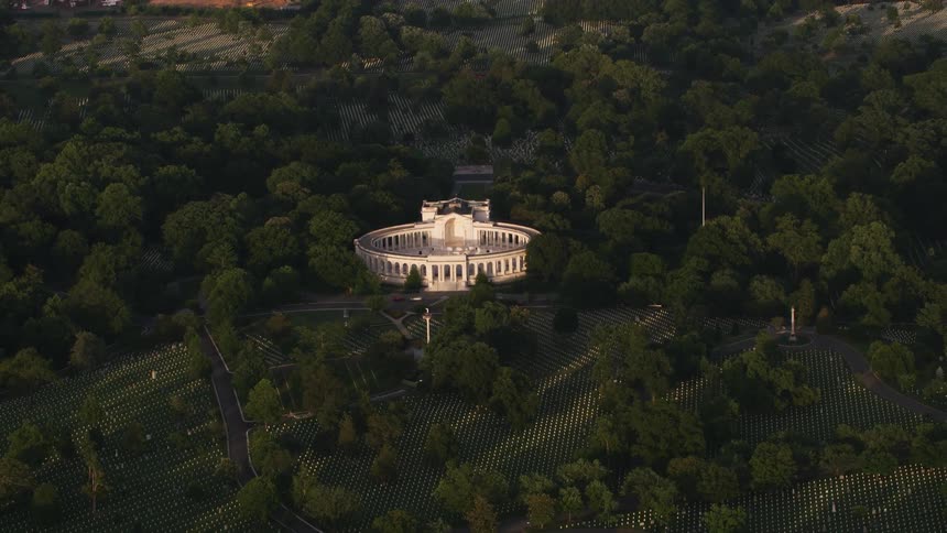 A building with pillars in the woods
