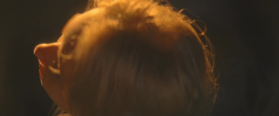 Close up view of a woman outdoors at night is displayed