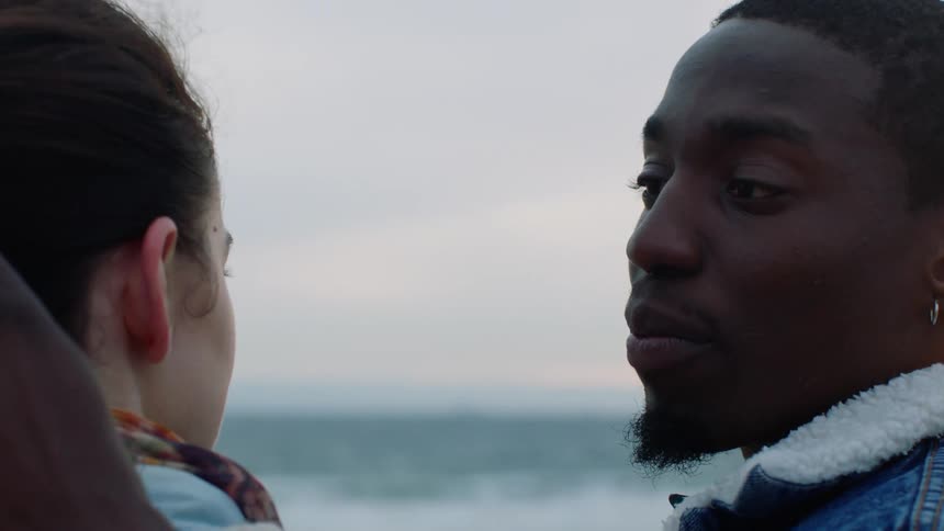 A man and woman talk together