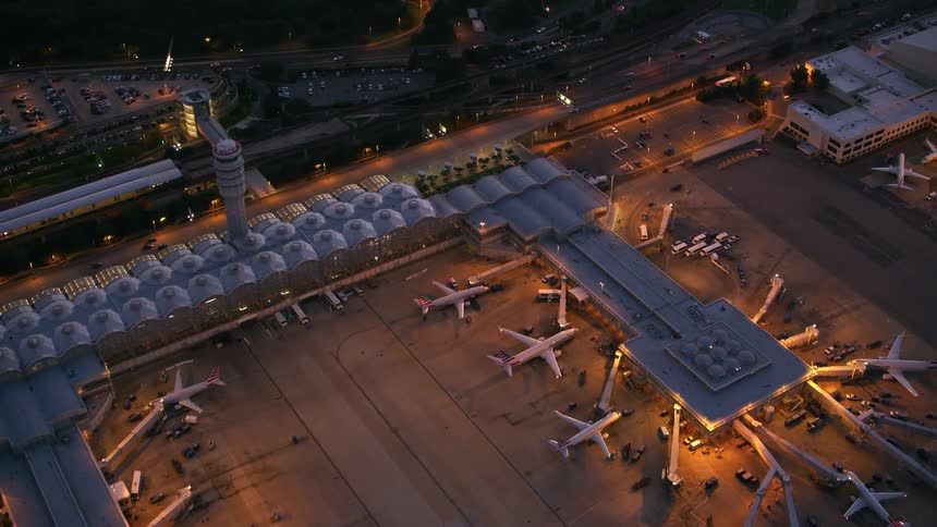 An airport next to a freeway at night