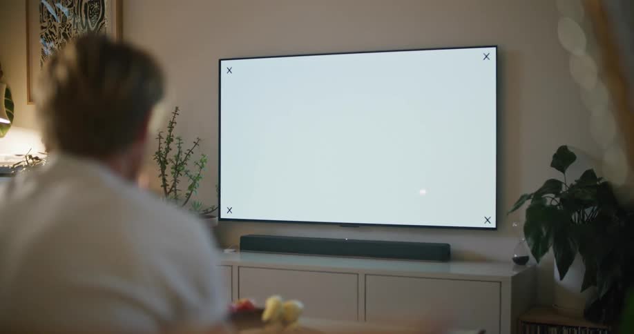 A man is watching the television