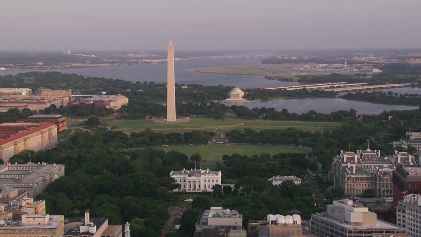 An aerial view of buildings and a monument