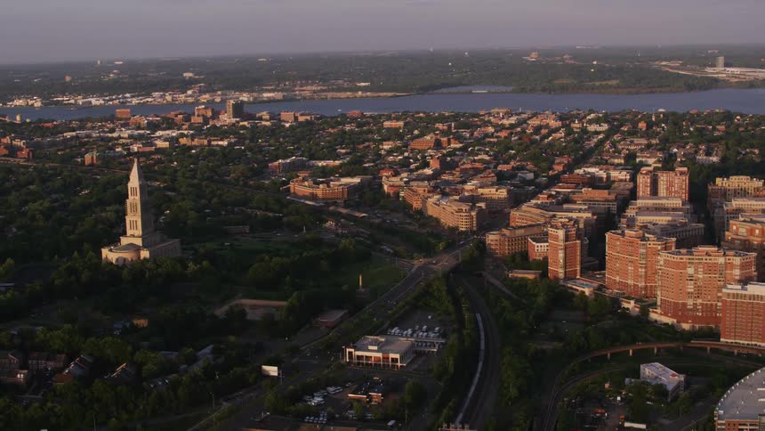Aerial view of a downtown city at dusk is displayed