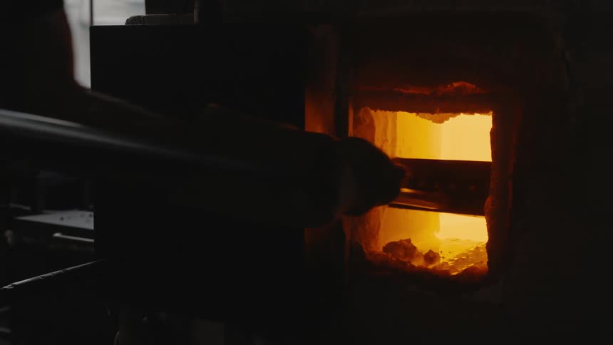 Adding coal to furnace