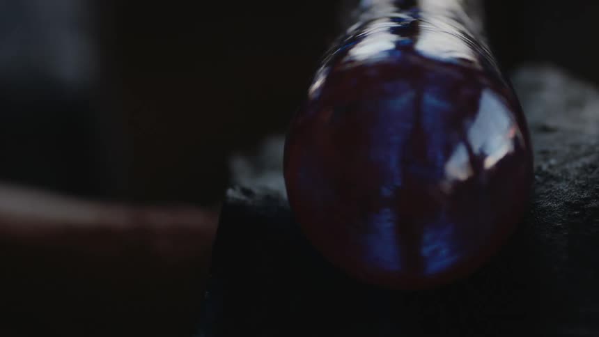 Close-up of spinning blue glass