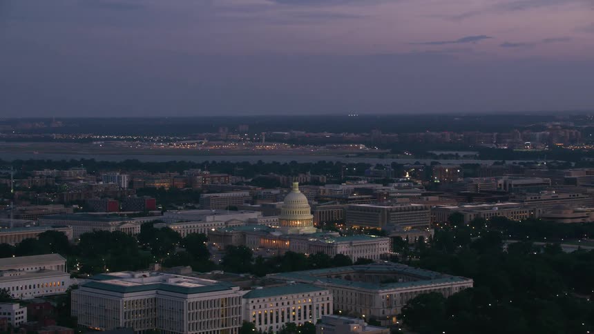 The dome of a government building is lit up at night