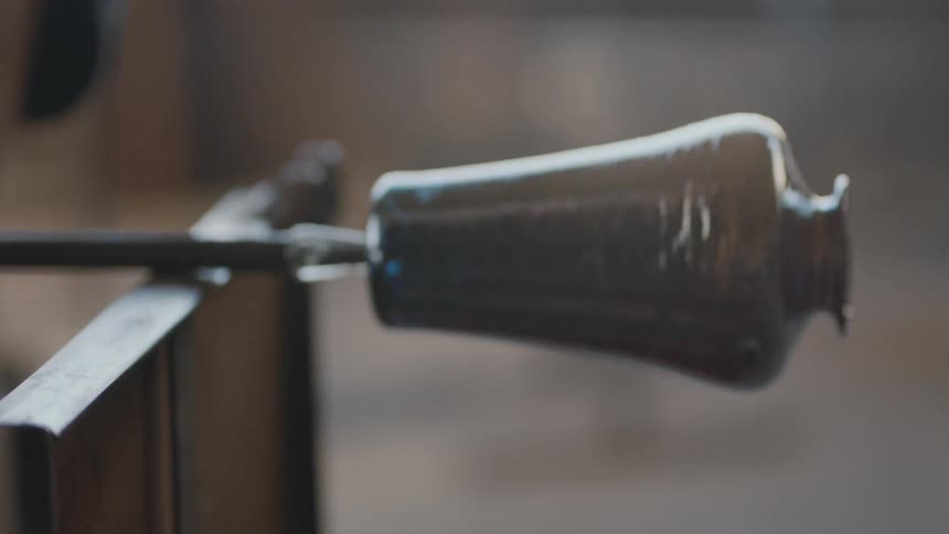 A glass blower working on a new project