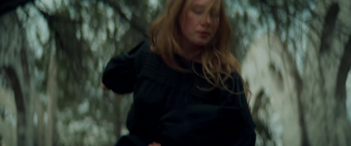 A woman dancing outdoors