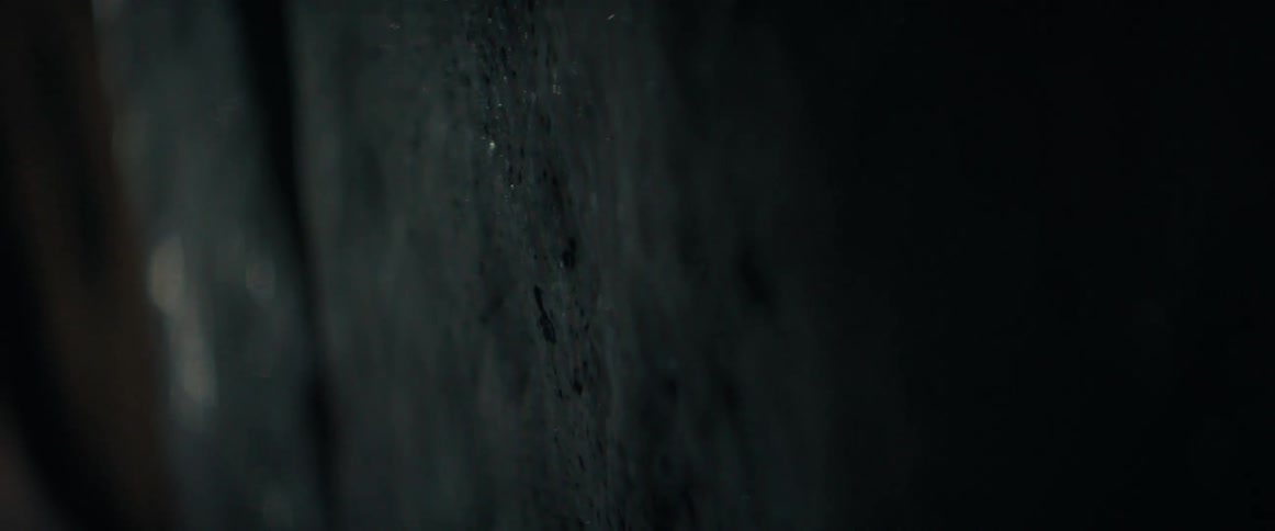 Light is flashing on walls in a dark room