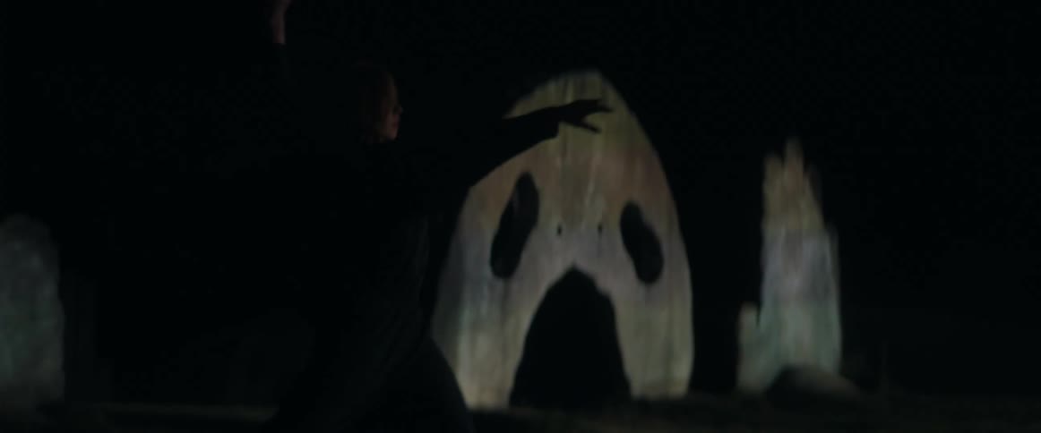 A woman is dancing by herself at night