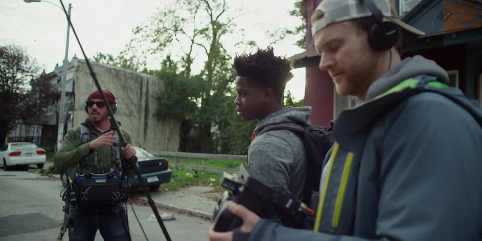 A film crew is working in the street