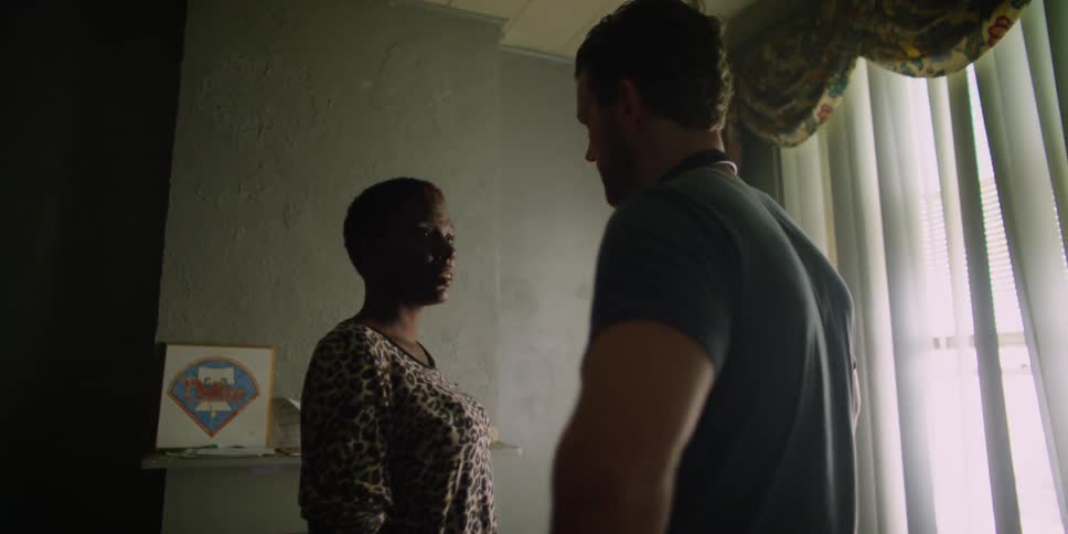 A man and women talk in a room