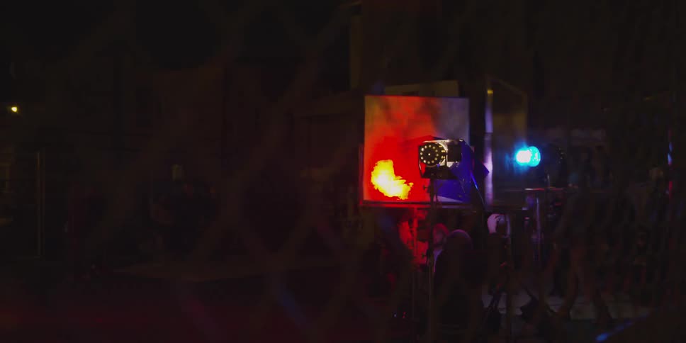 A club has many people and flashing lights