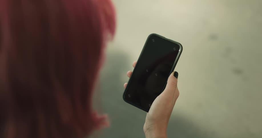 A woman is using her cell phone