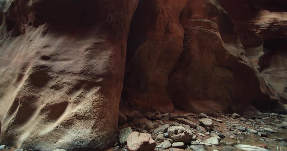 Rocks and debris fill the inside of a cave
