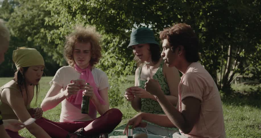 Friends play cards together in the park