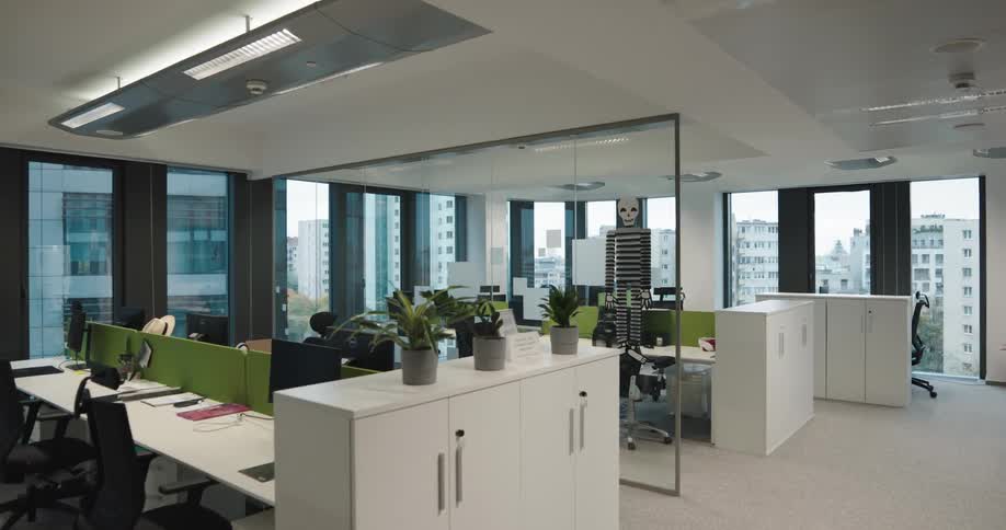 A large work area in an office building during the day
