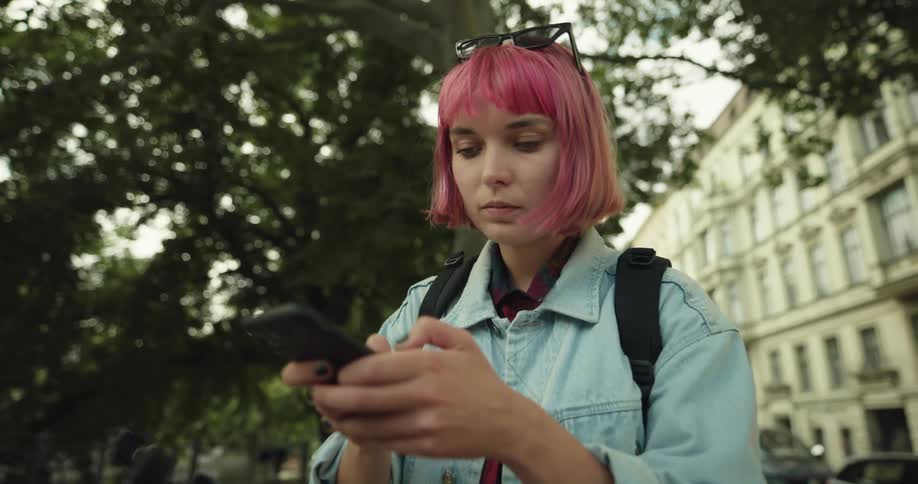 A woman takes out her cell phone