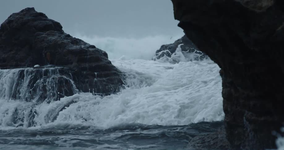 Ocean waves crash against the rocks
