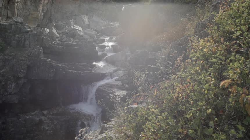 Water falling down a rocky cliff