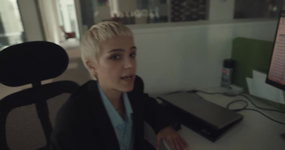 Point of view footage of a person walking through an office to meet and talk to a coworker