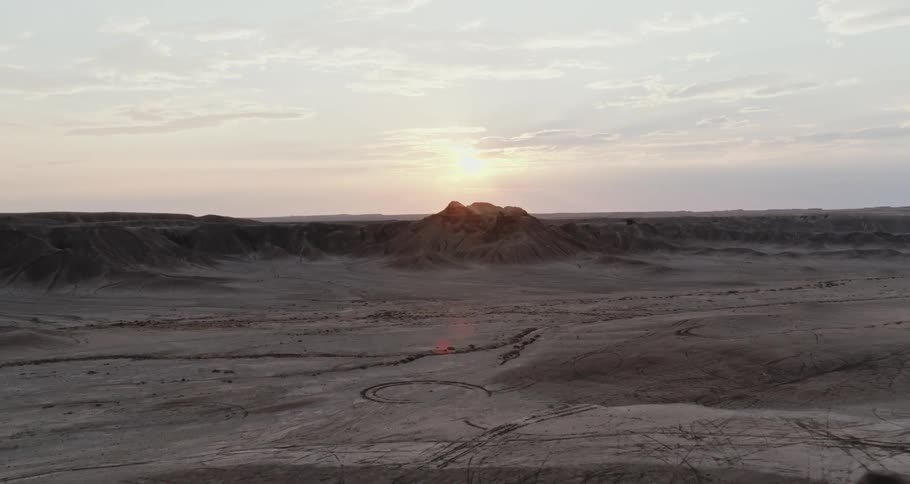Aerial view of a rock formation is displayed at dusk