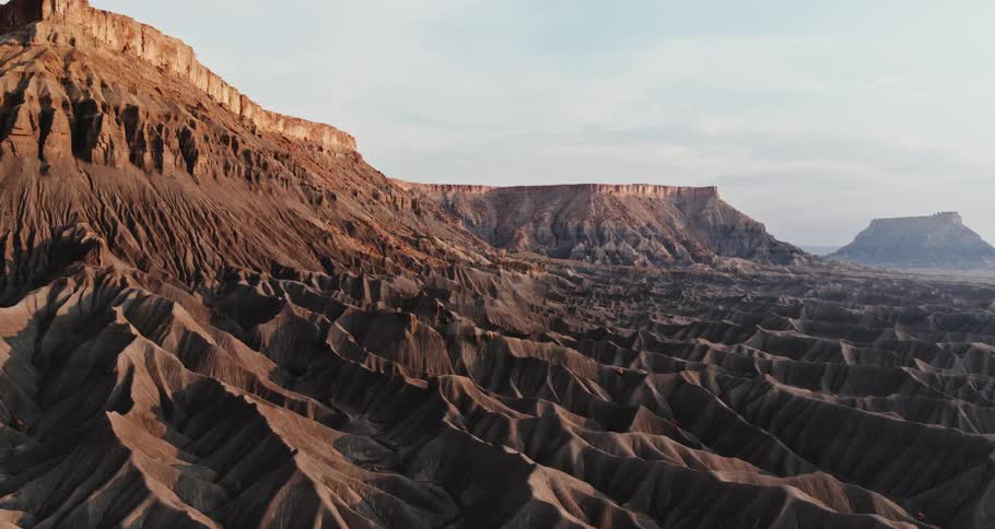 Wide shot of a mountain range made up of stone and sand
