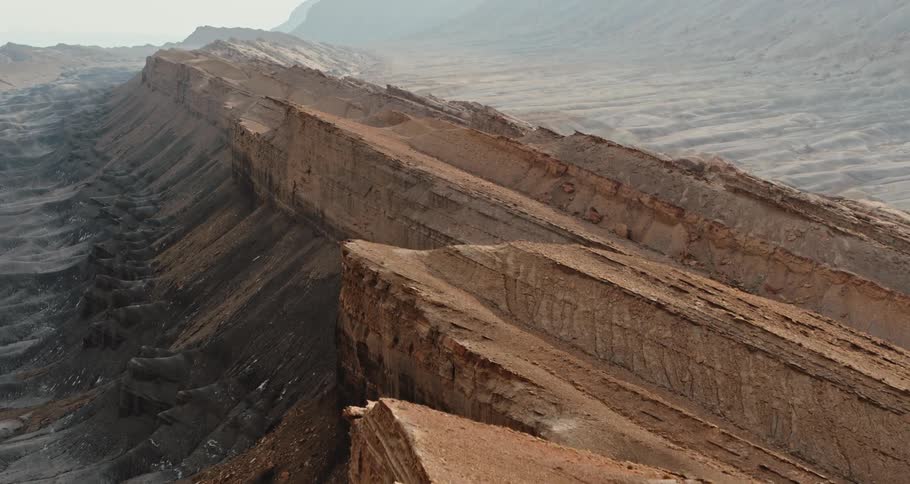 Jagged rock formations are protruding from the ground in the wilderness