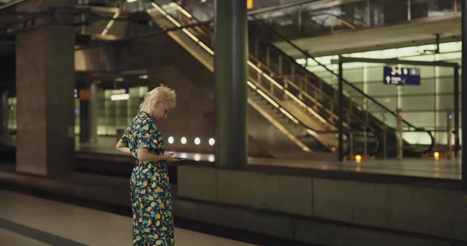 A woman is standing in an empty building