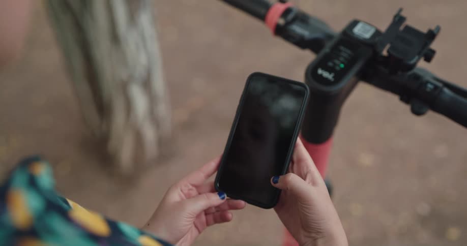 A person is tying on their cell phone