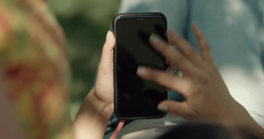 A woman using a smartphone outdoors