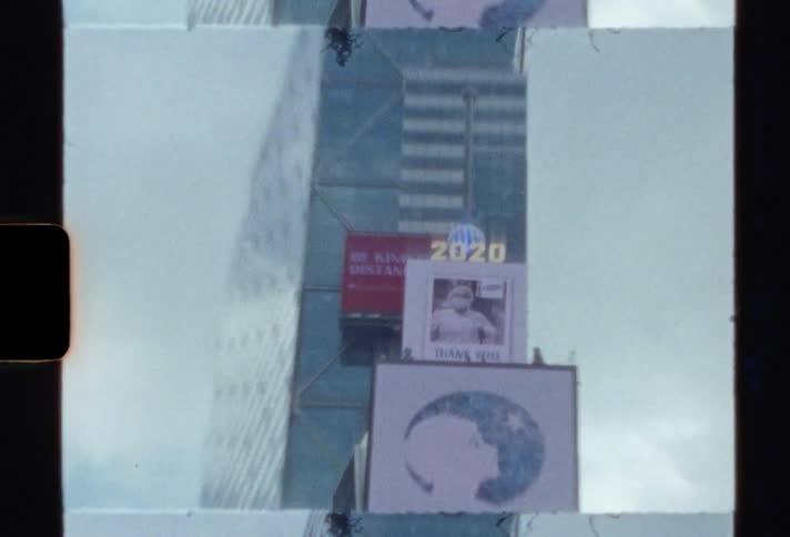 The footage of the city shows a billboard on a building