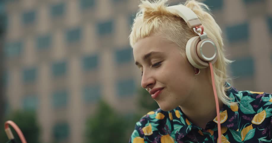 A woman is talking on a cellphone in a downtown city