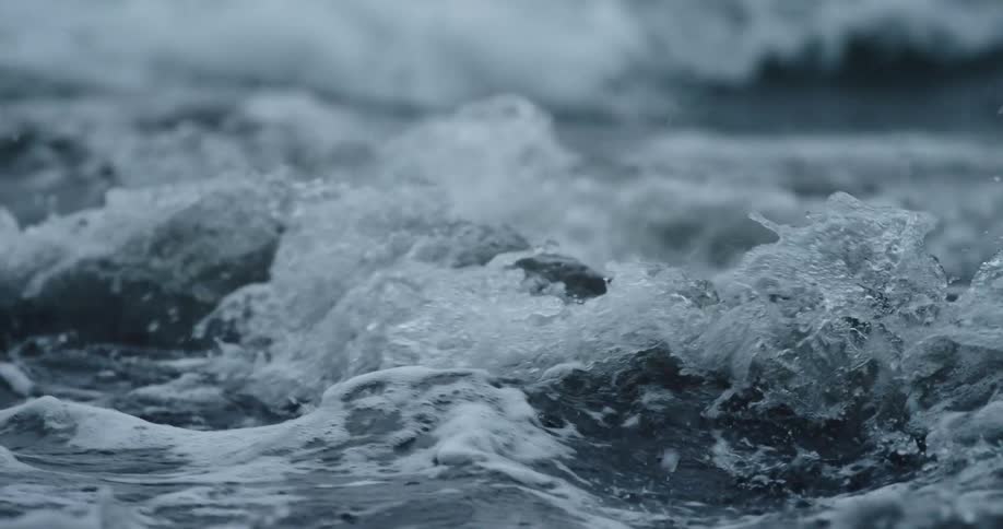 Rough water splashes and foams as the ocean waves break