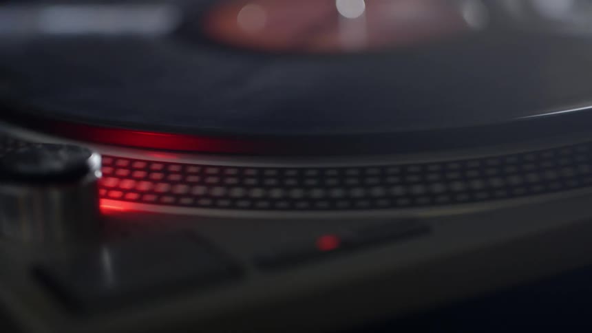 A record is spinning on a turn table