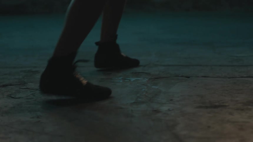 A person is exercising in an empty room