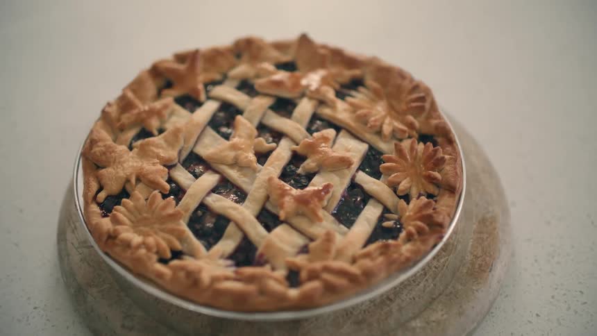 Close up view of a cooked pie is displayed on a counter