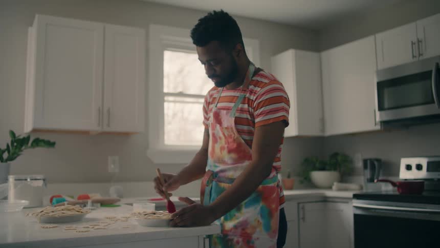 A man bakes pies at home