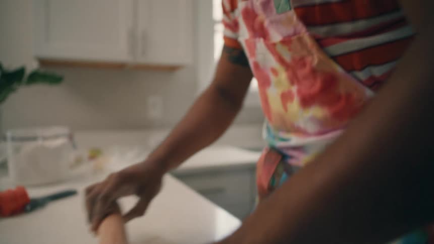 A man is cooking and preparing food in his kitchen