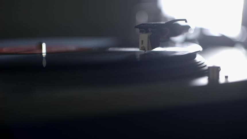 Close up of a record player spinning a record