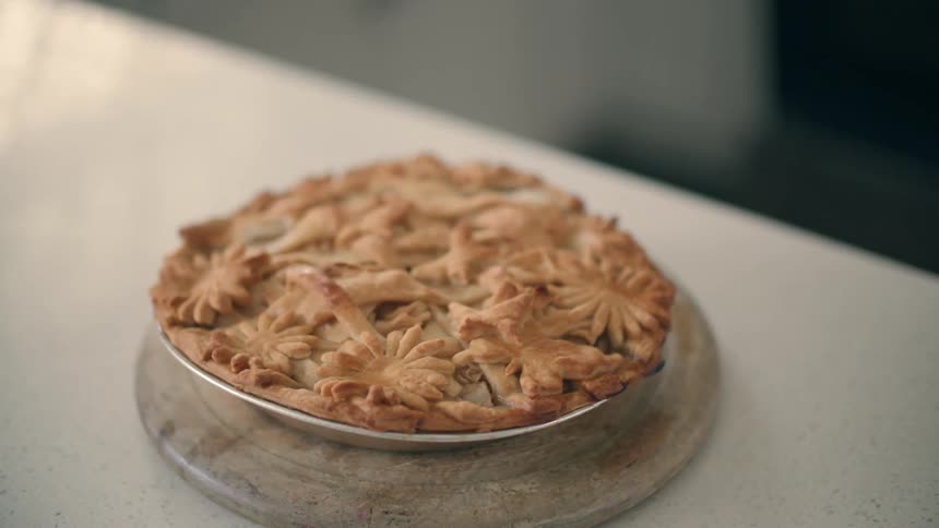 A dessert is sitting on an empty counter top
