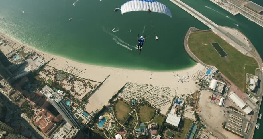 A person is gliding over the shore