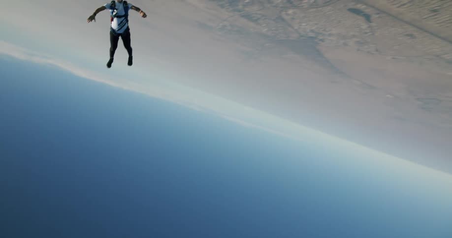 A man skydiving outdoors