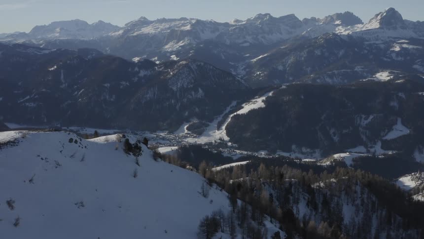 An aerial view of a snowy mountain range