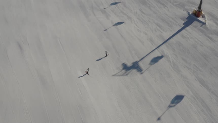 People are skiing down the slopes