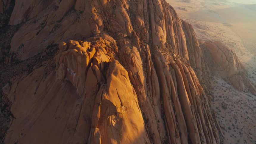 Golden hour over arid desert mountains