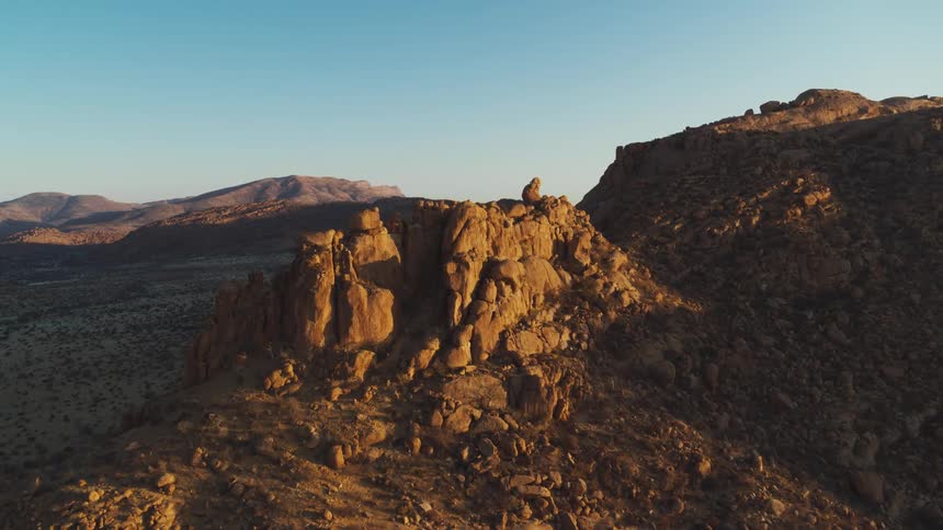 Aerial view of desert mountains and rock formations